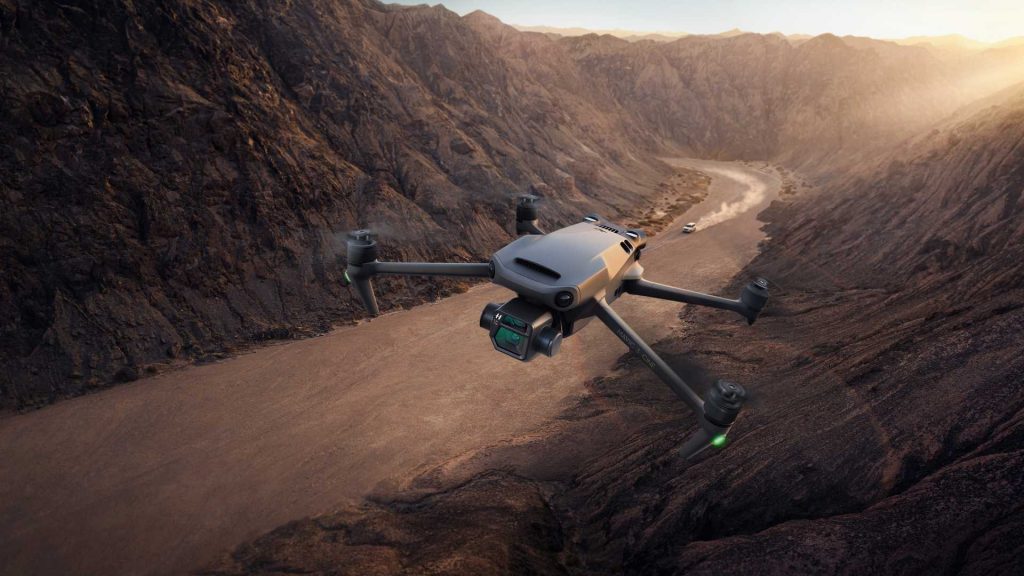 A long range drone flying high above the mountainous valley