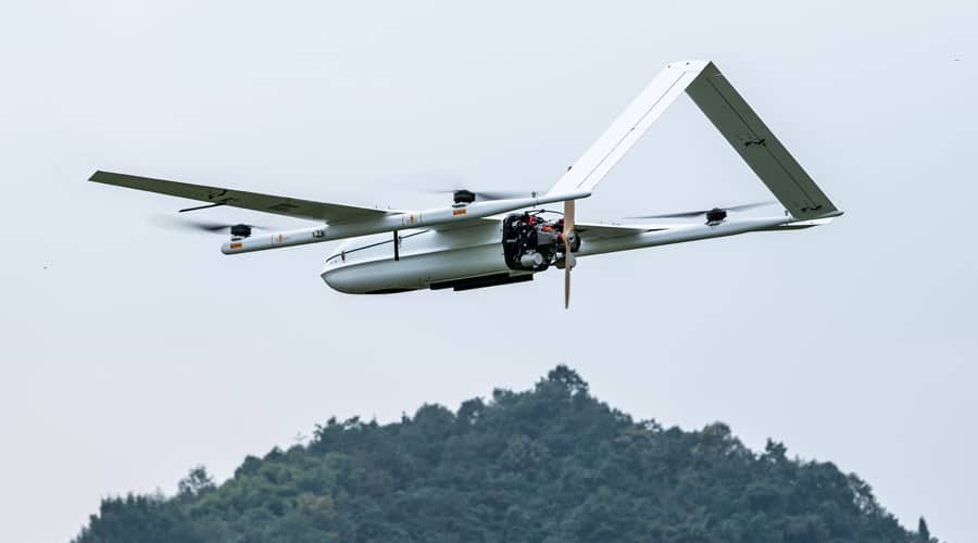 A long range drone hovering up in the distant sky