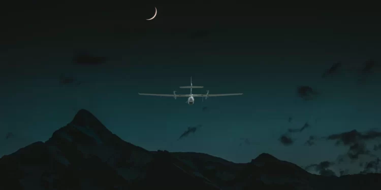 A night vision drone hovering in the sky at night time