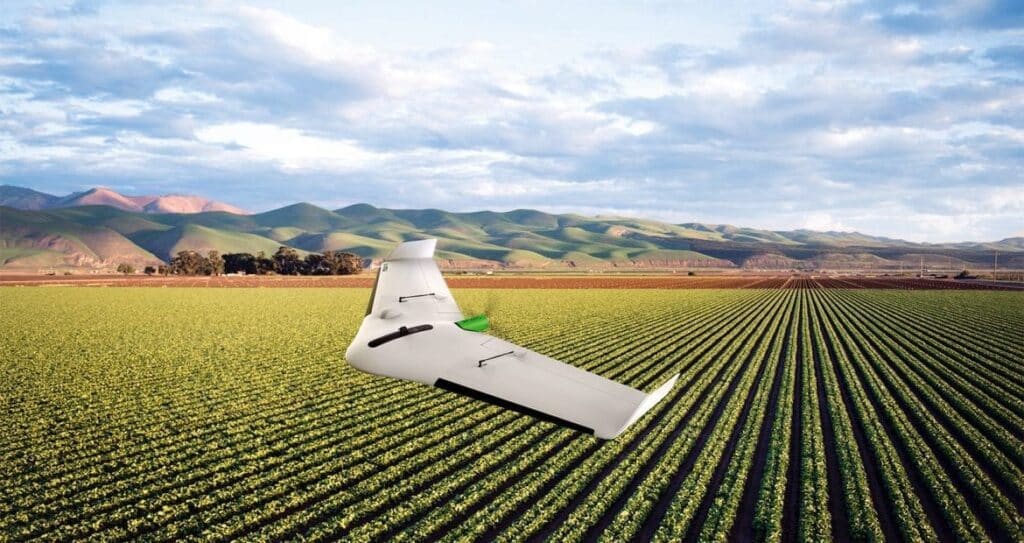 Delair UX drone above a field