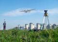 a drone flying above the field for surveying