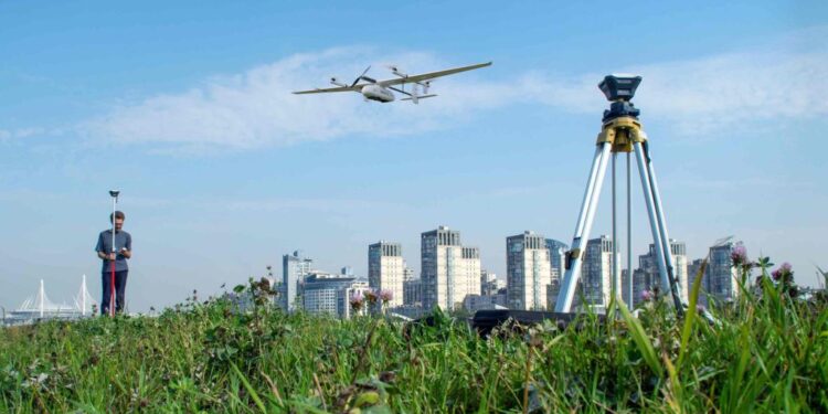 a drone flying above the field for surveying