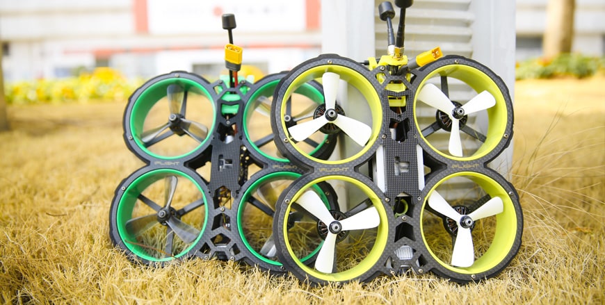 iFlight bumblebee drones placed on grass in green and yellow color