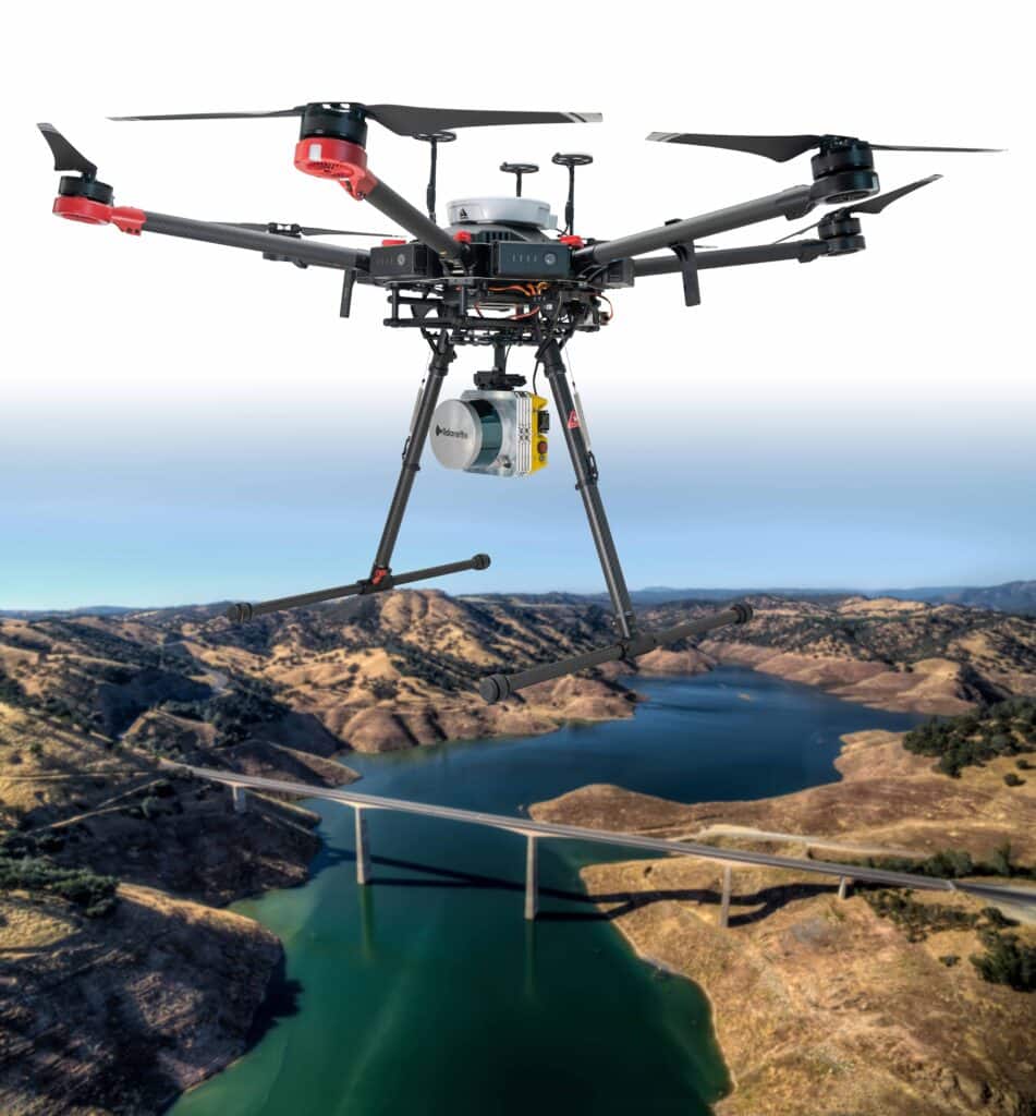 A view of a lidar drone high above a lake and mountain way