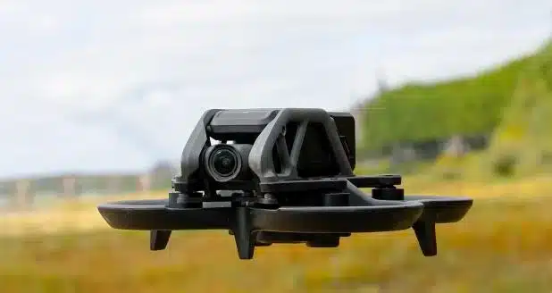 a flying fpv drone in feilds