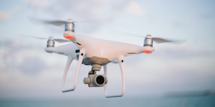 a drone is flyinh high in air