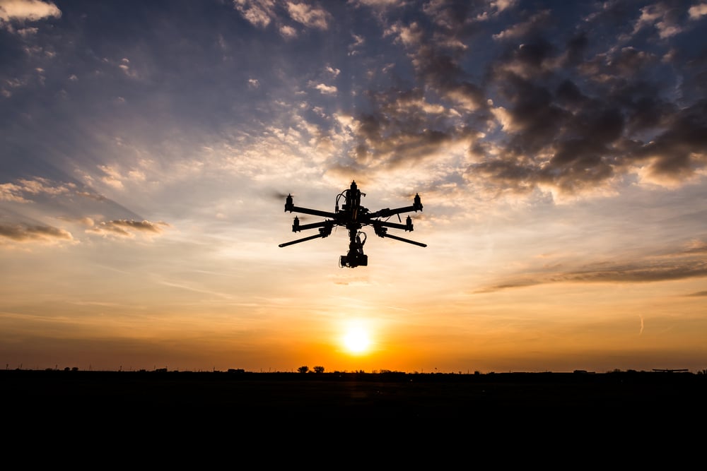 Professional Drone Flying In The Sunset