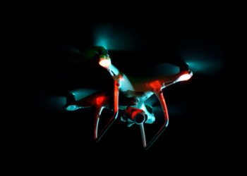 a drone flying in night time