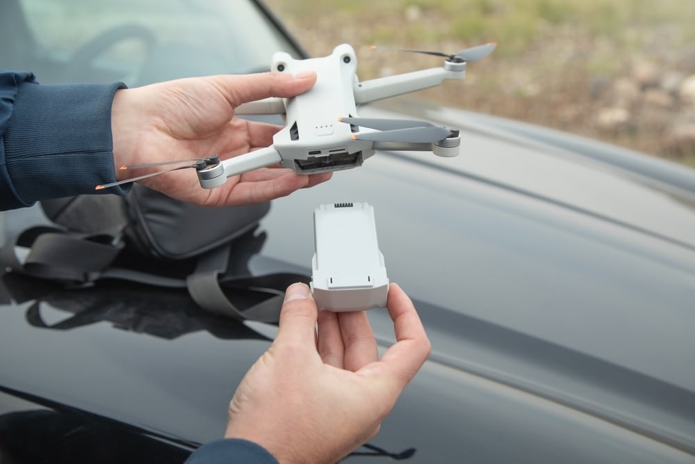 Man Changing Drone Battery In Outdoor